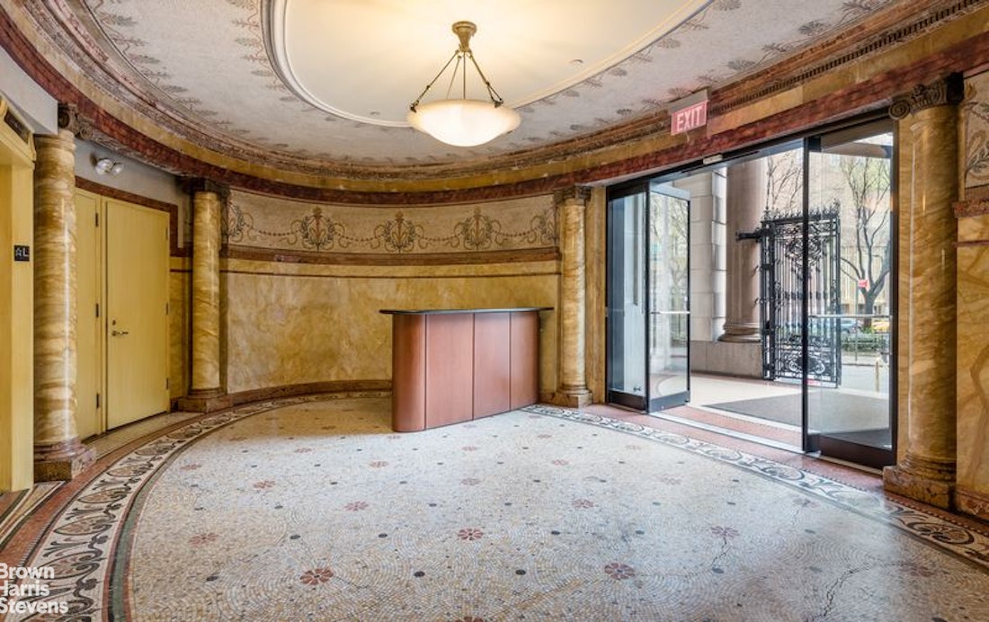 260 West Broadway, Unit 6D Manhattan, NY 10013 - Photo 13 of 15 a bedroom with a bed and a chandelier