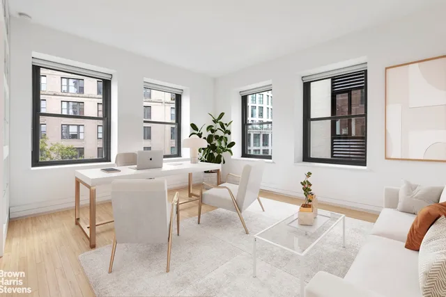a living room with furniture and windows