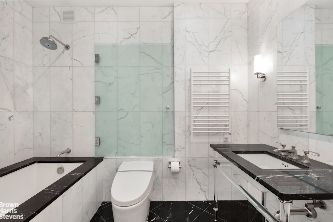 260 West Broadway, Unit 6D Manhattan, NY 10013 - Photo 8 of 15 a bathroom with a sink toilet and shower