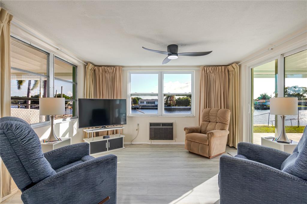 5644 Riddle Road Holiday, FL 34690 - Photo 15 of 58 a living room with furniture and a flat screen tv