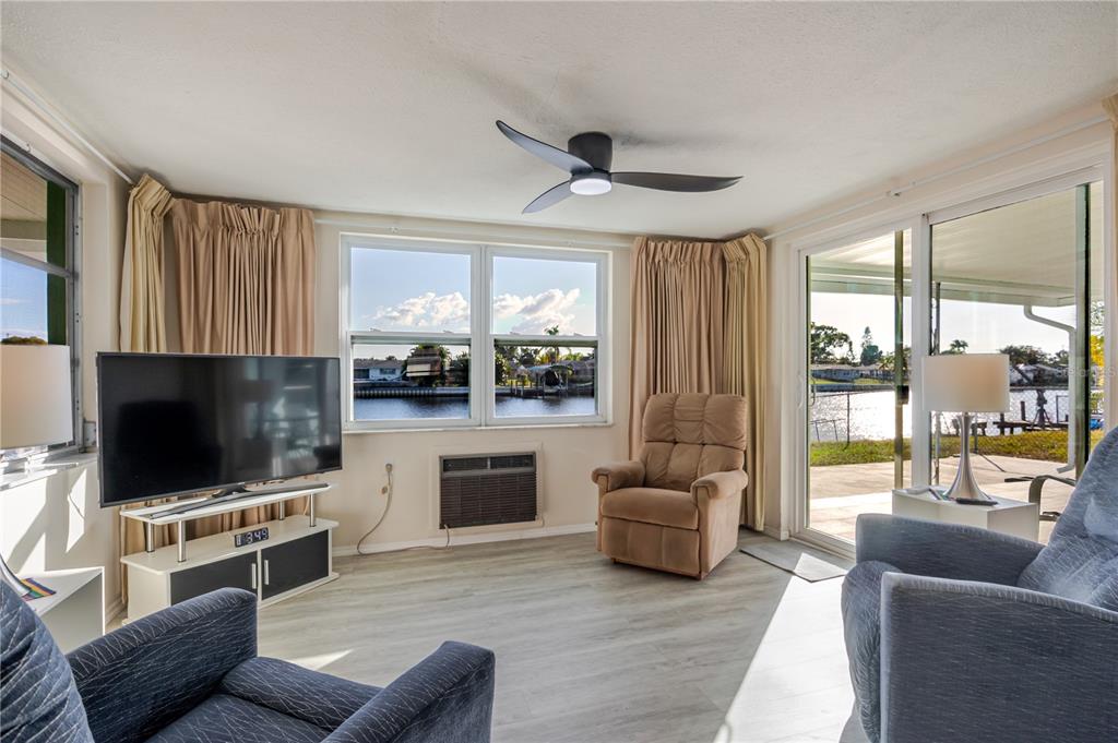 5644 Riddle Road Holiday, FL 34690 - Photo 16 of 58 a living room with furniture and a flat screen tv