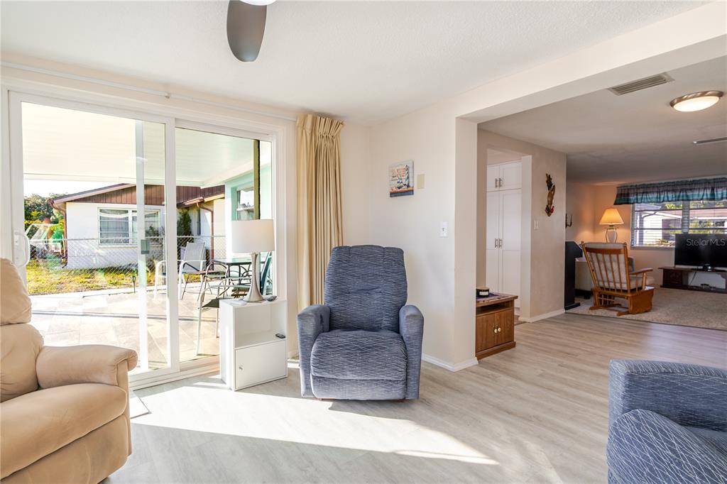 5644 Riddle Road Holiday, FL 34690 - Photo 17 of 58 a living room with furniture and a large window