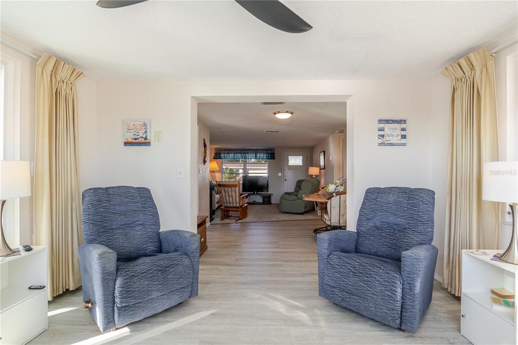 5644 Riddle Road Holiday, FL 34690 - Photo 18 of 58 a living room with furniture and a large window