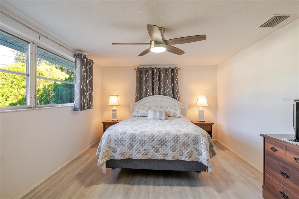 5644 Riddle Road Holiday, FL 34690 - Photo 23 of 58 a bedroom with a bed and window