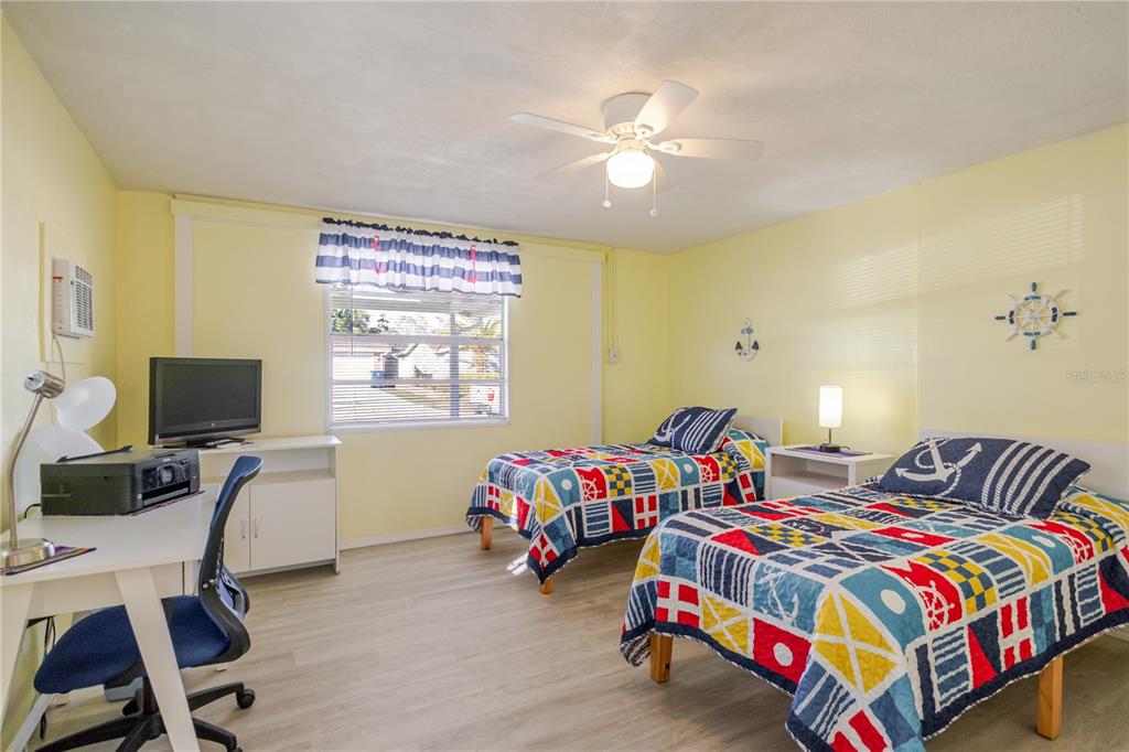 5644 Riddle Road Holiday, FL 34690 - Photo 29 of 58 a bedroom with bed and a window