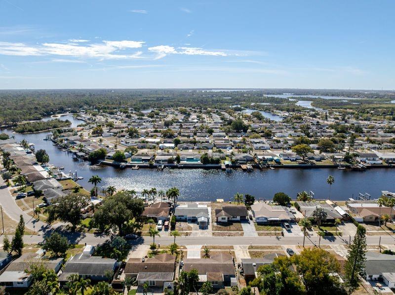 5644 Riddle Road Holiday, FL 34690 - Photo 3 of 58 an aerial view of a city with houses