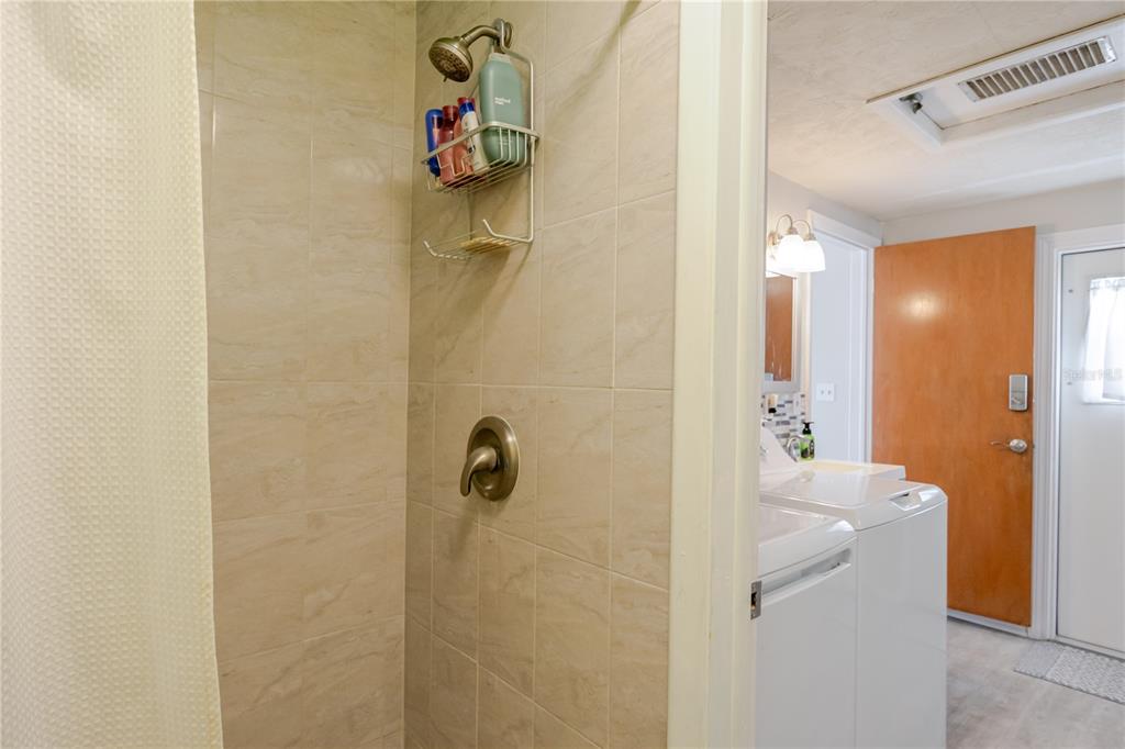 5644 Riddle Road Holiday, FL 34690 - Photo 32 of 58 a bathroom with a shower