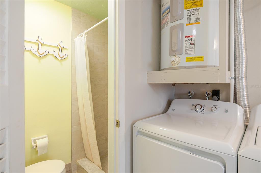5644 Riddle Road Holiday, FL 34690 - Photo 34 of 58 a utility room with dryer and washer