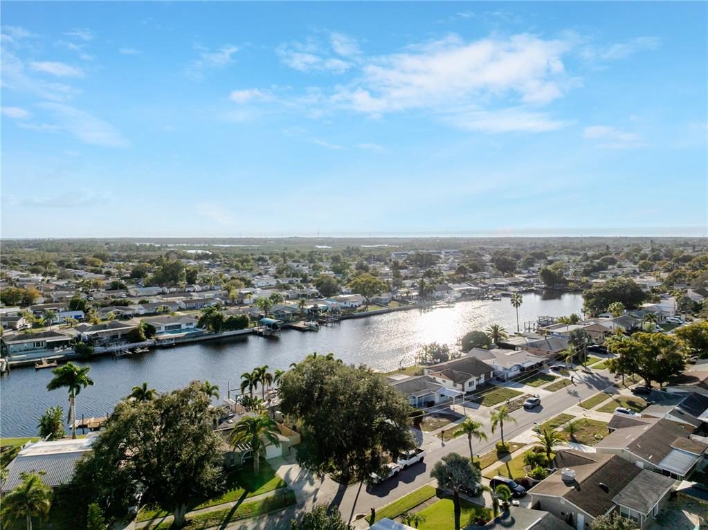 5644 Riddle Road Holiday, FL 34690 - Photo 35 of 58 an aerial view of residential building and lake view