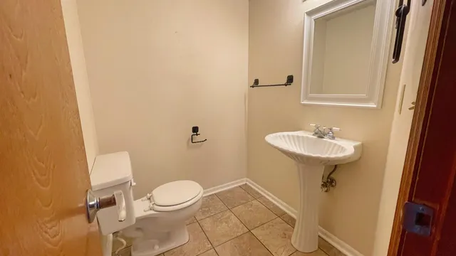 a bathroom with a sink toilet