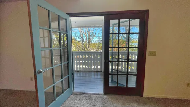 a view of hallway with wooden stairs