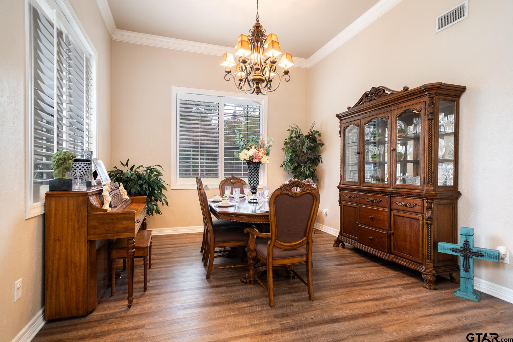 2 Joseph Circle Longview, TX 75601 - Photo 11 of 35 a view of a dining room with furniture window and wooden floor