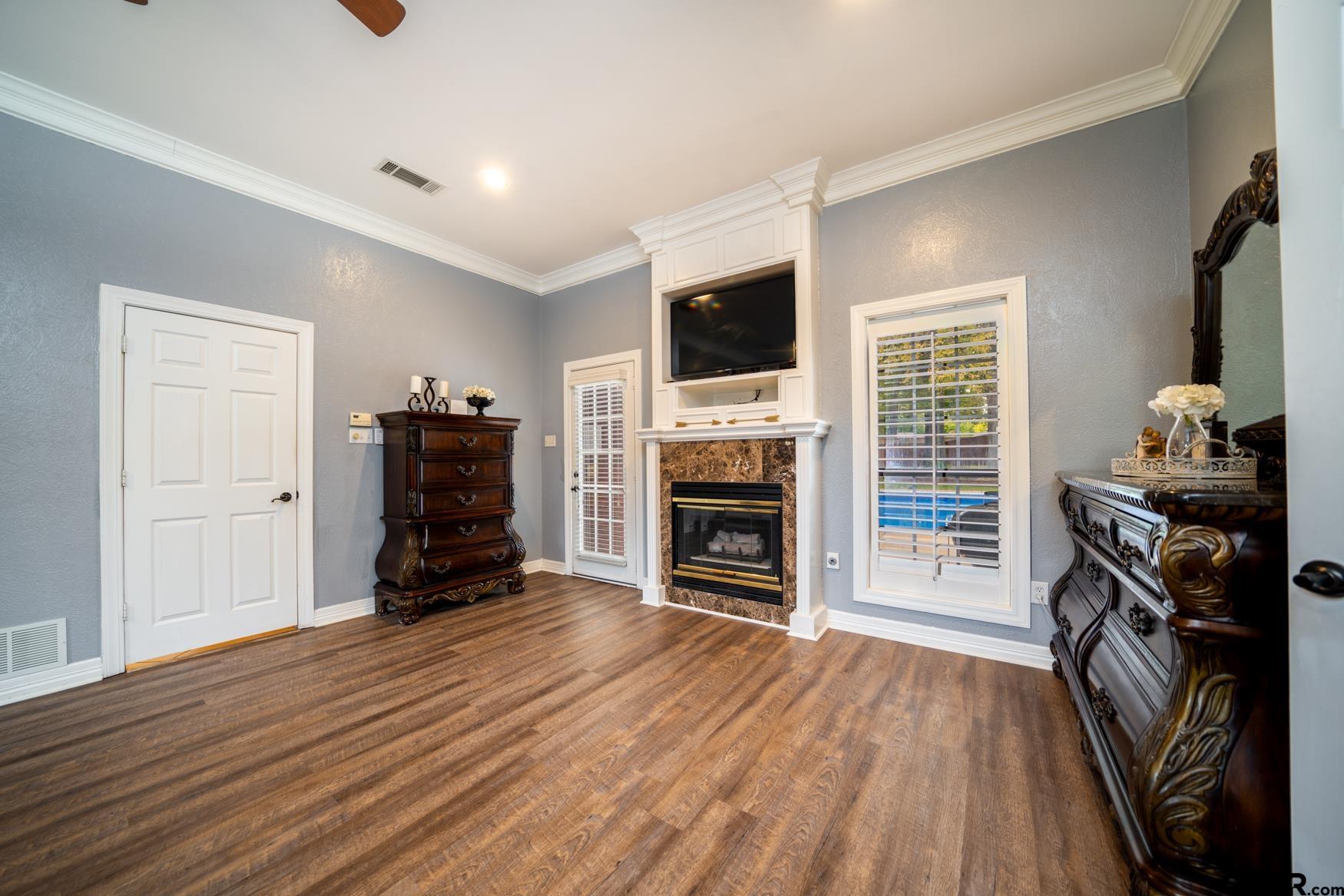 2 Joseph Circle Longview, TX 75601 - Photo 17 of 35 a view of a livingroom with a fireplace and a window