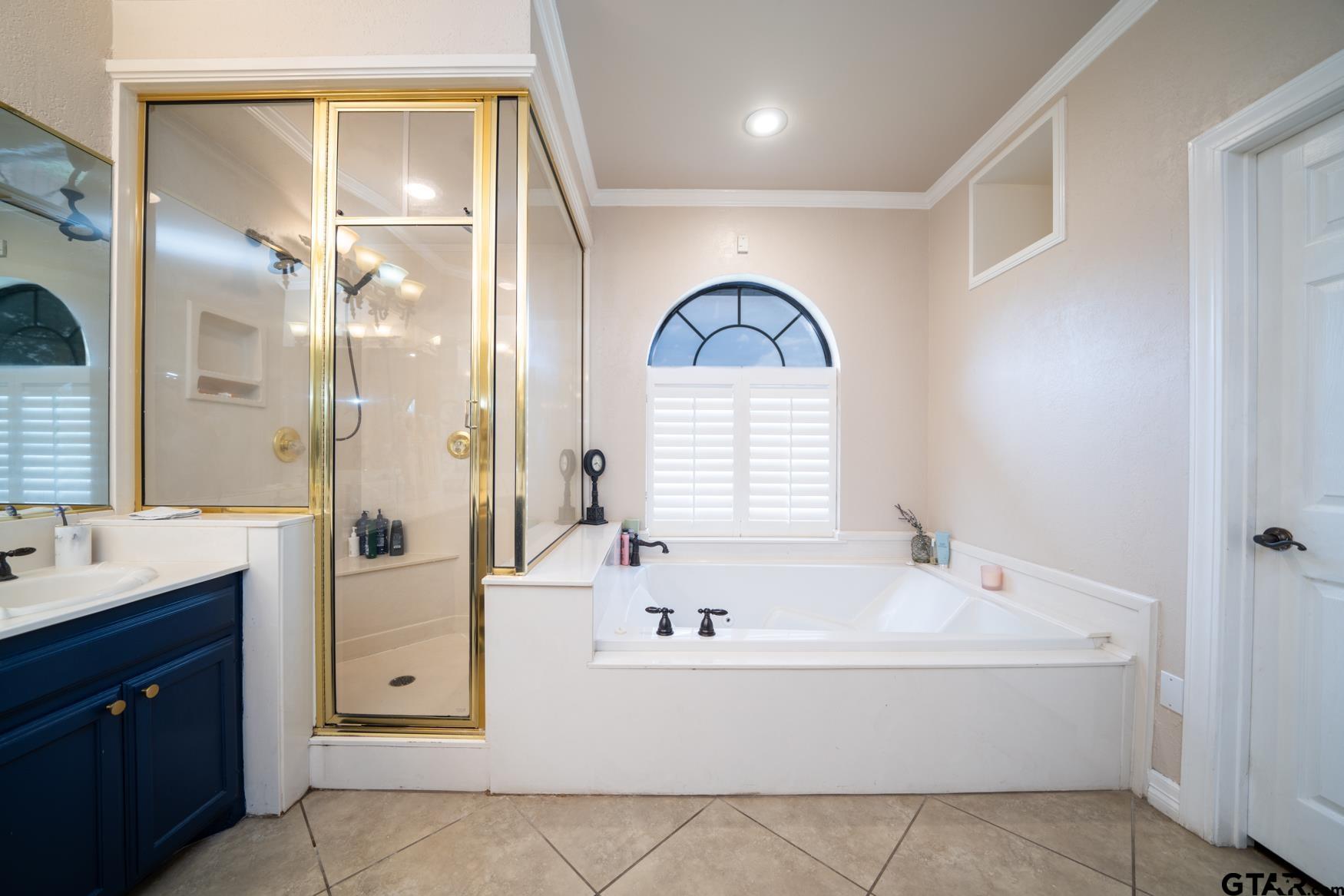 2 Joseph Circle Longview, TX 75601 - Photo 19 of 35 a white bath tub sitting next to a bathroom sink