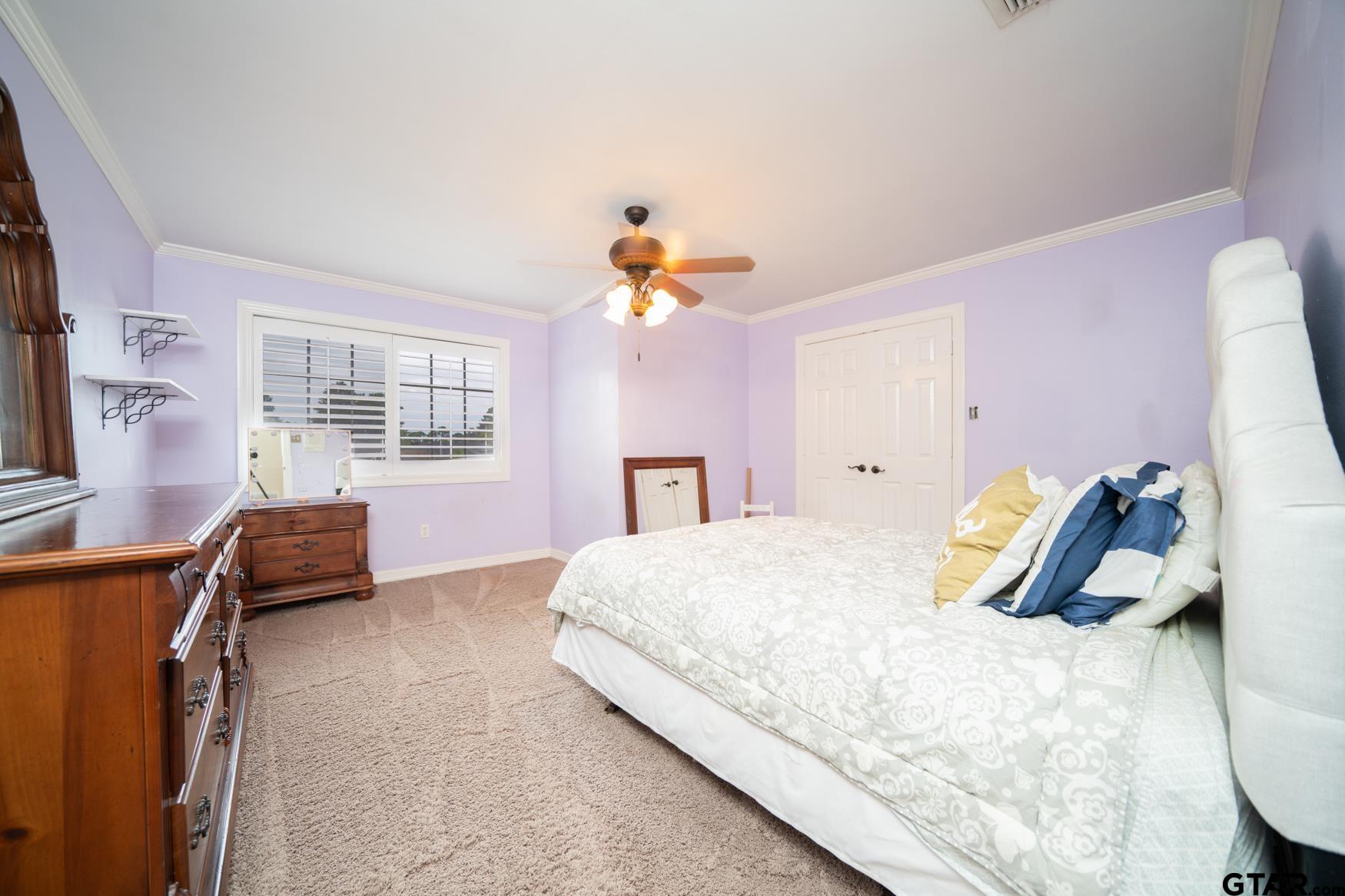 2 Joseph Circle Longview, TX 75601 - Photo 21 of 35 a bedroom with a bed and wooden floor