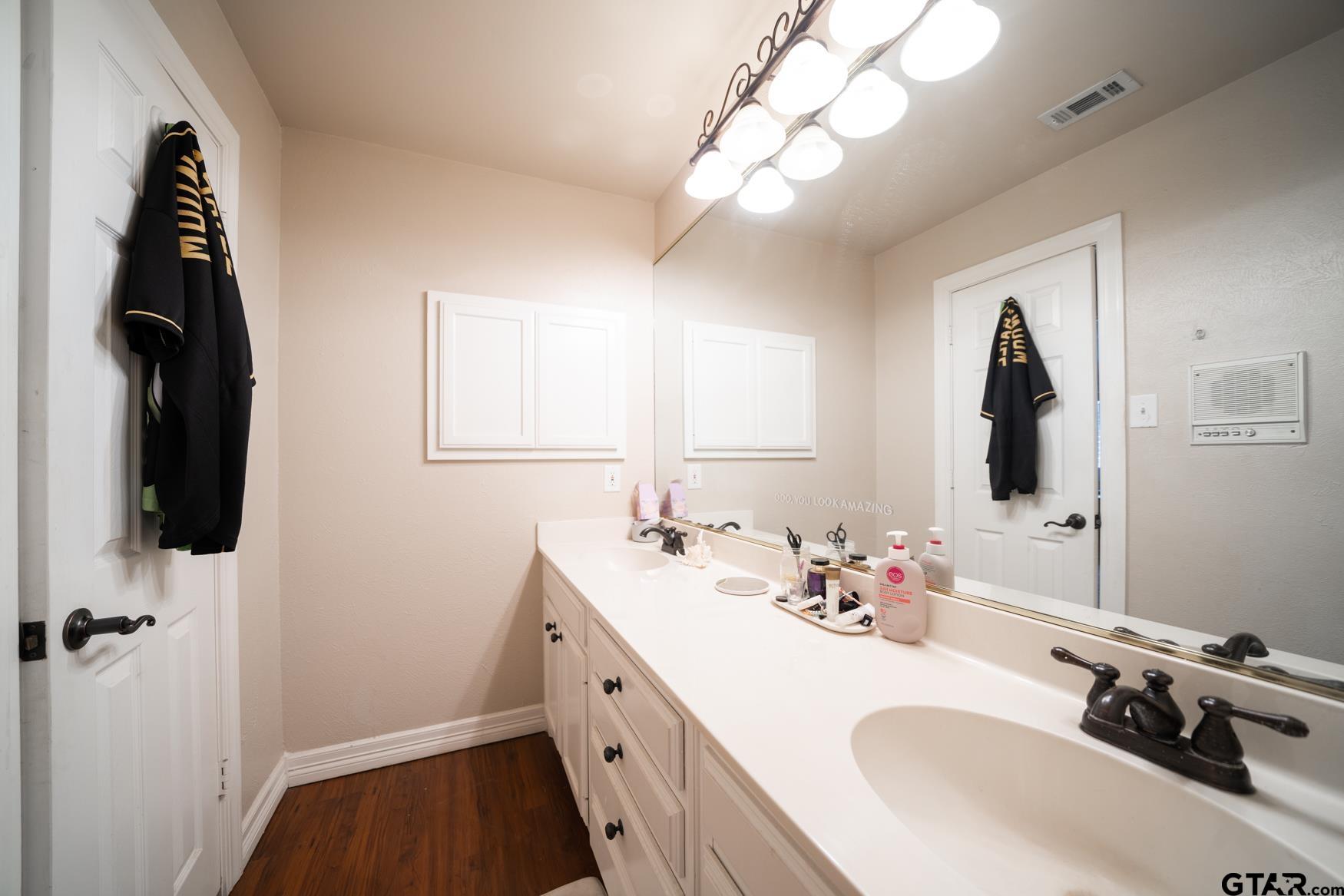 2 Joseph Circle Longview, TX 75601 - Photo 25 of 35 a bathroom with a sink and a mirror