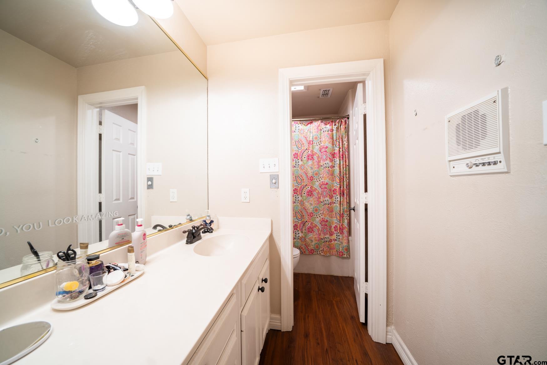 2 Joseph Circle Longview, TX 75601 - Photo 26 of 35 a en suite bathroom with a double vanity sink and a mirror