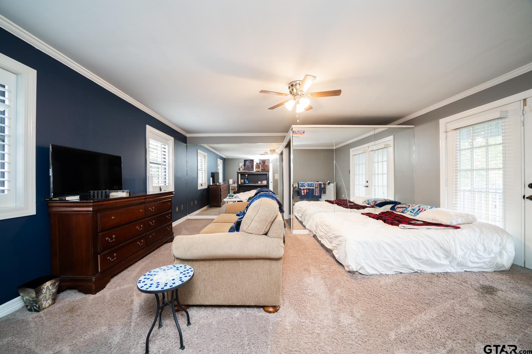 2 Joseph Circle Longview, TX 75601 - Photo 27 of 35 a bedroom with furniture and a flat screen tv