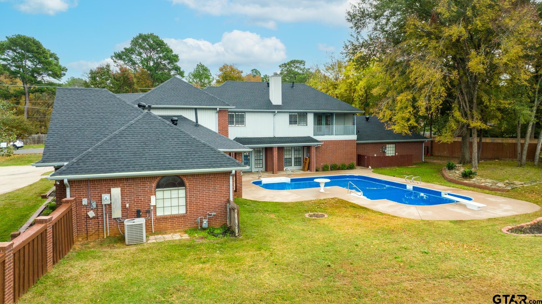 2 Joseph Circle Longview, TX 75601 - Photo 31 of 35 a view of a house with swimming pool and a yard