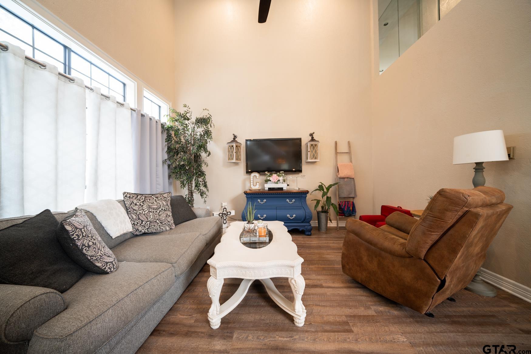 2 Joseph Circle Longview, TX 75601 - Photo 5 of 35 a living room with furniture a flat screen tv and a window