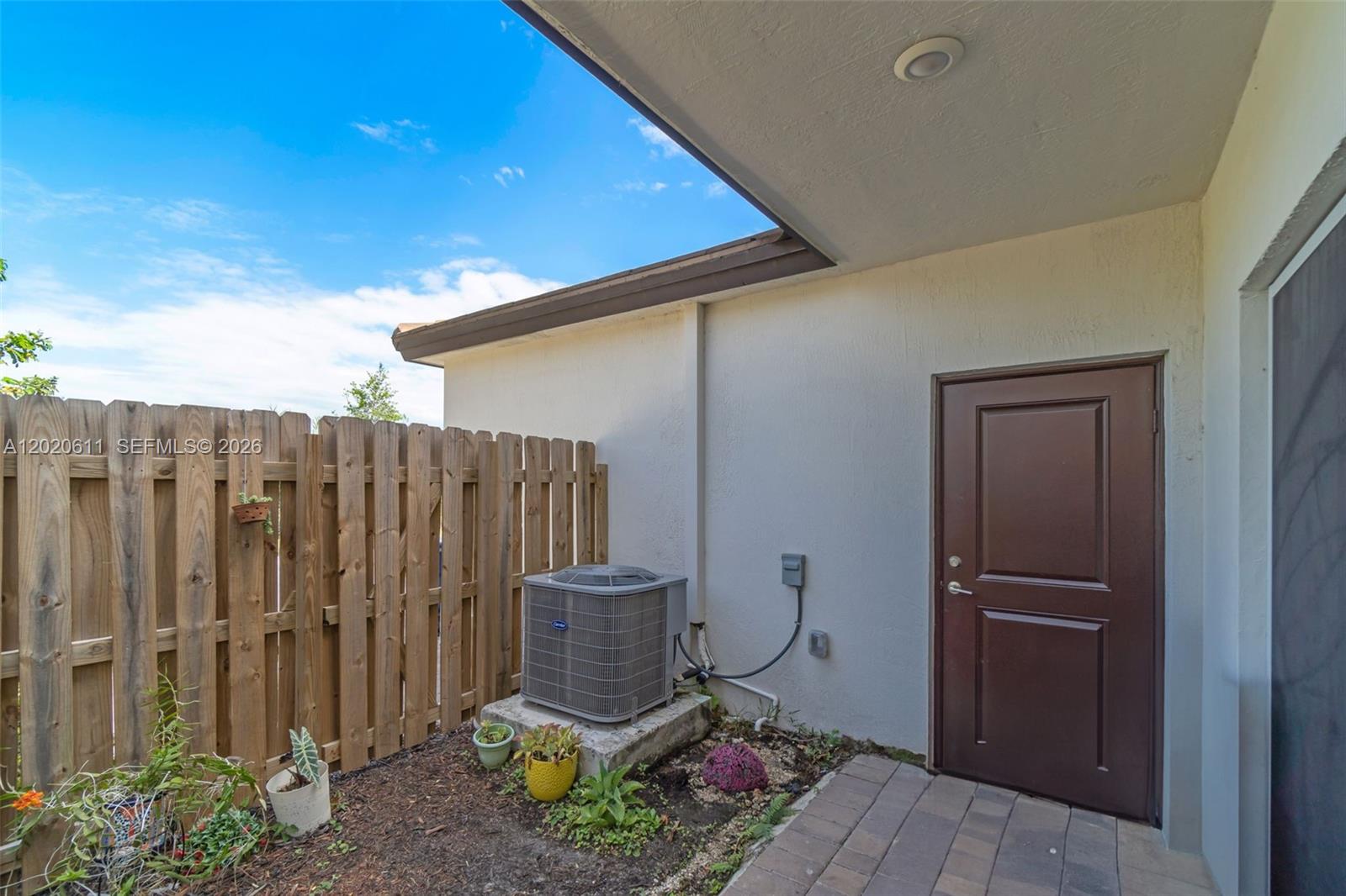 26455 Southwest 148th Avenue Homestead, FL 33032 - Photo 23 of 35 a view of a backyard with wooden fence