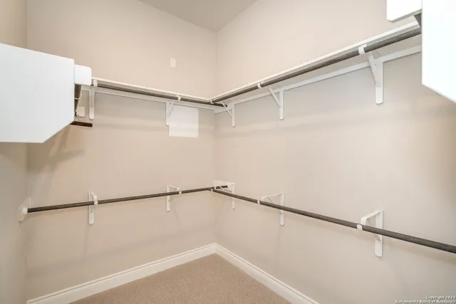 a bathroom with a tub a sink and mirror