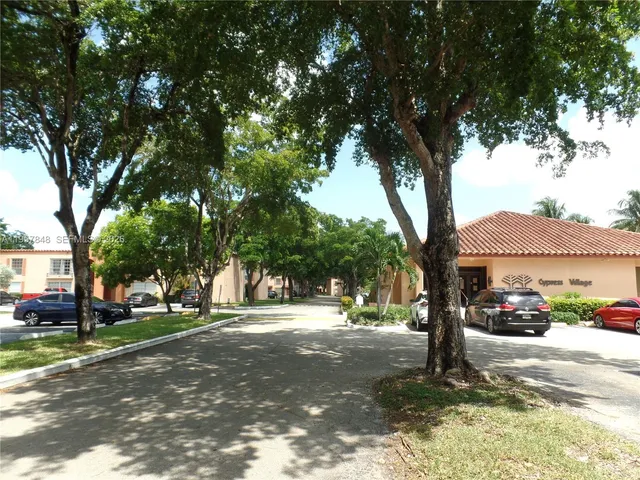 a car parked in front of a houses
