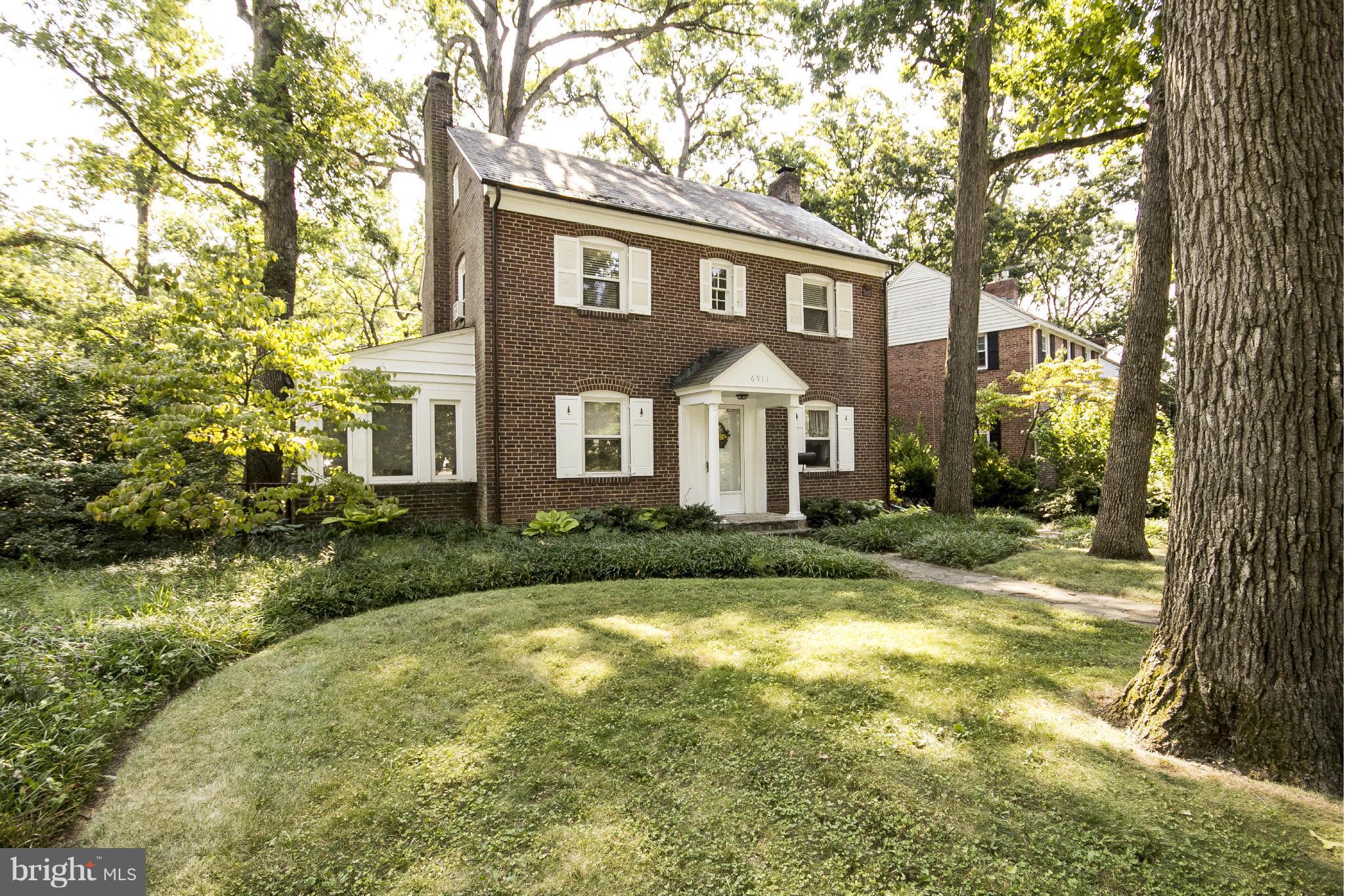 6911 Kenleigh Road Baltimore, MD 21212 - Photo 1 of 26 a front view of a house with garden