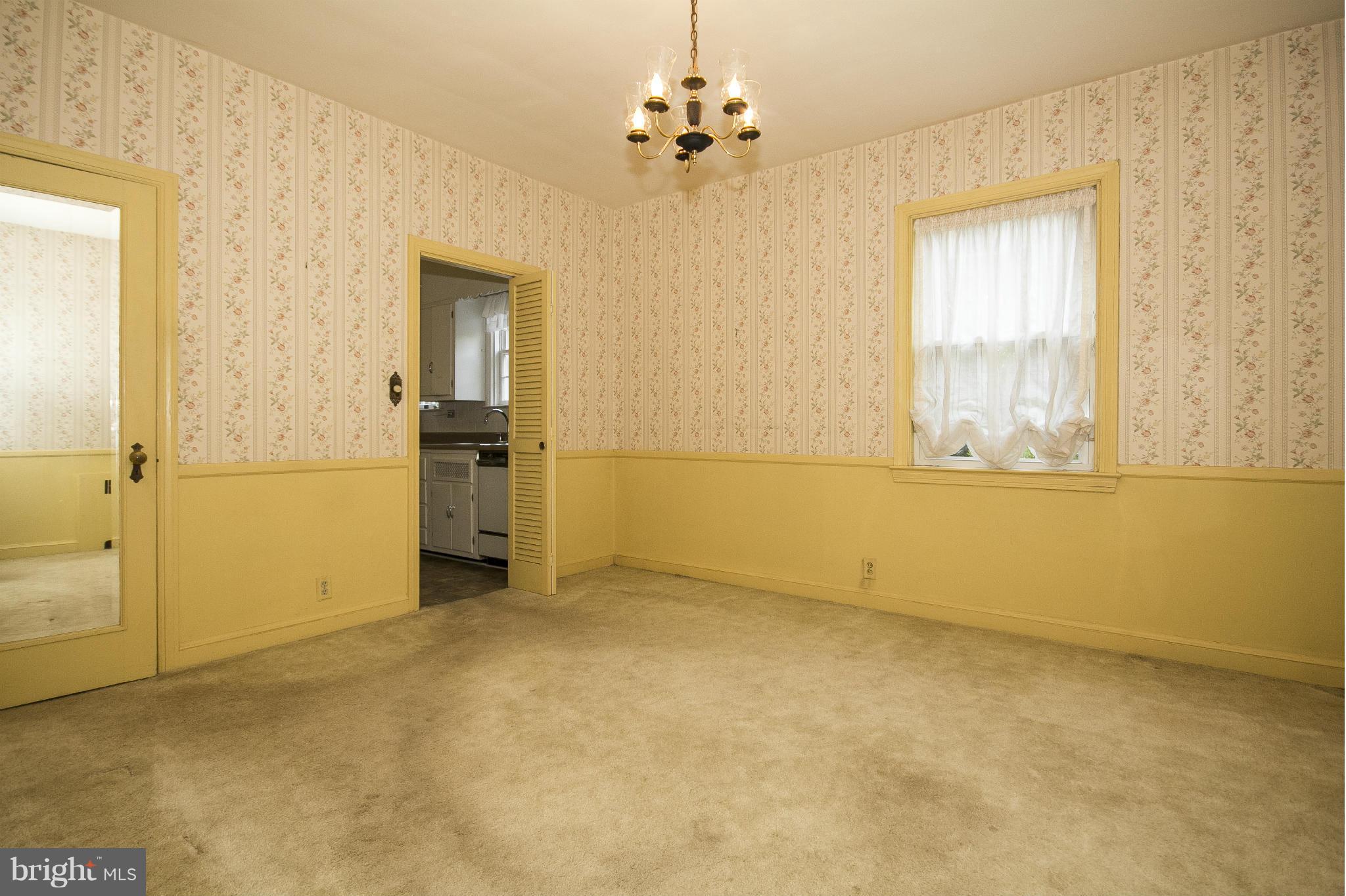6911 Kenleigh Road Baltimore, MD 21212 - Photo 11 of 26 an empty room with a window