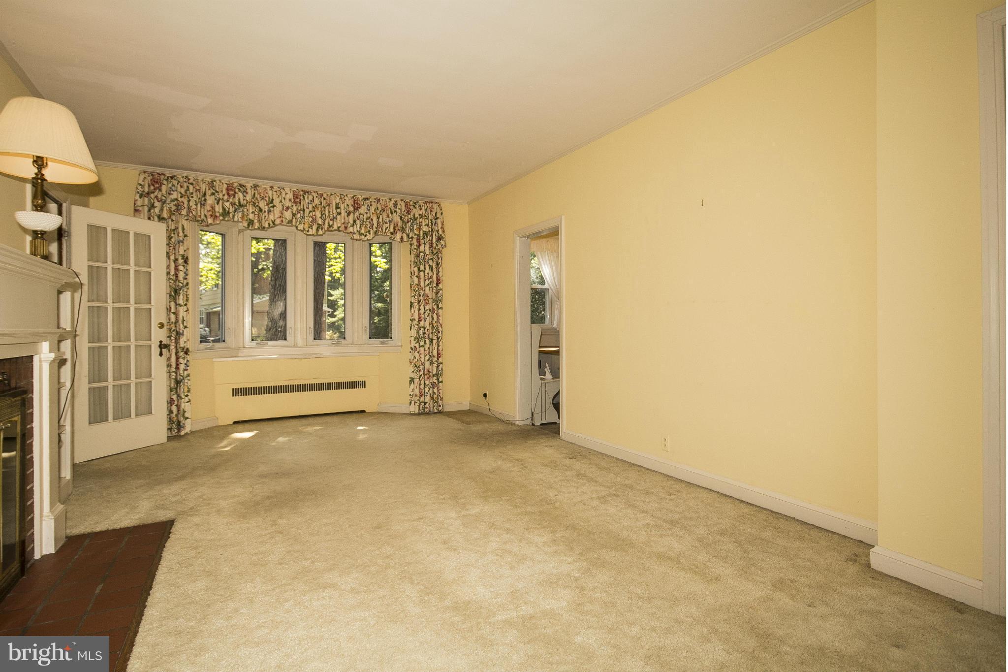6911 Kenleigh Road Baltimore, MD 21212 - Photo 4 of 26 a view of an empty room with wooden floor