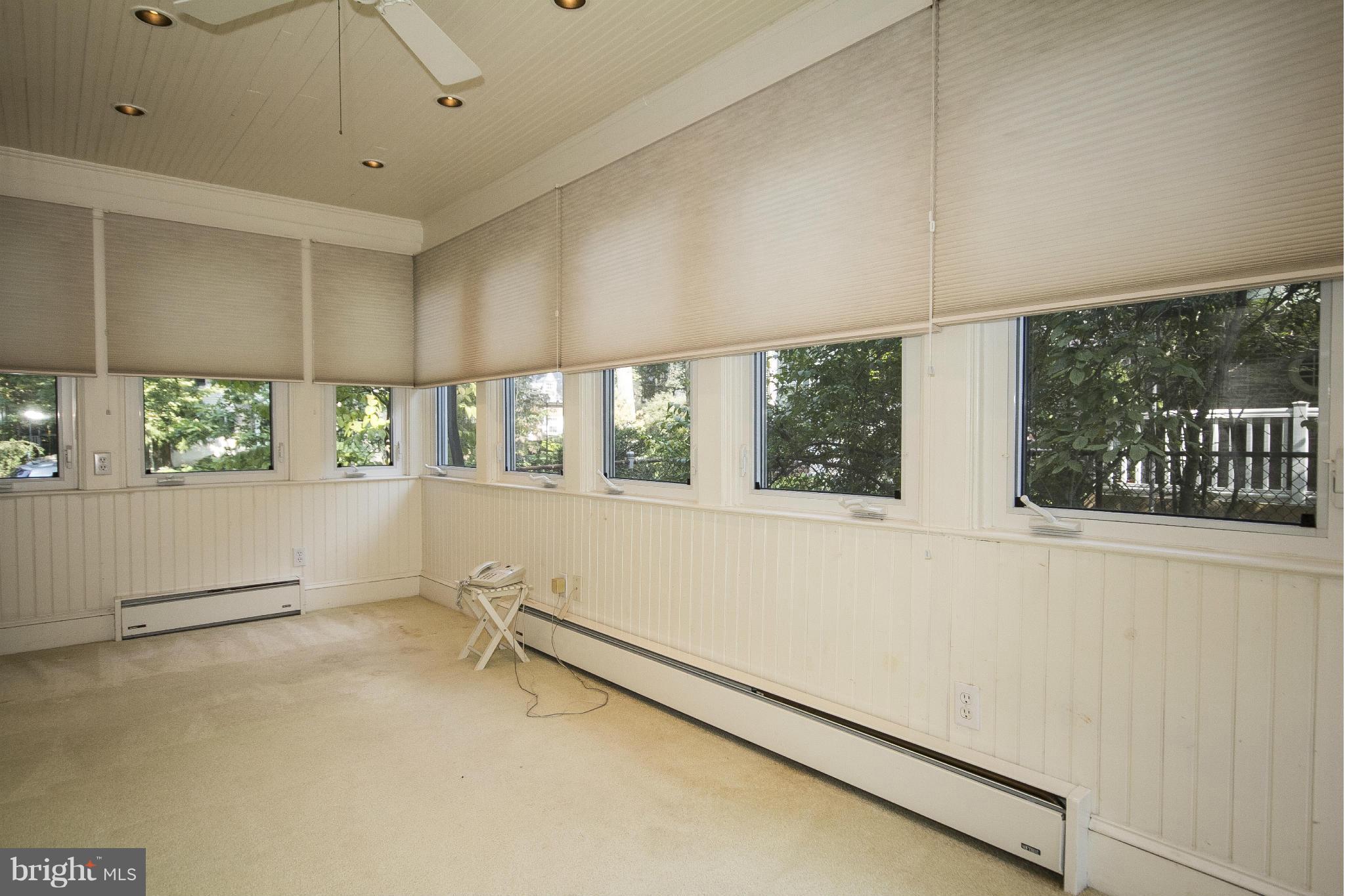 6911 Kenleigh Road Baltimore, MD 21212 - Photo 5 of 26 a view of an empty room with a window