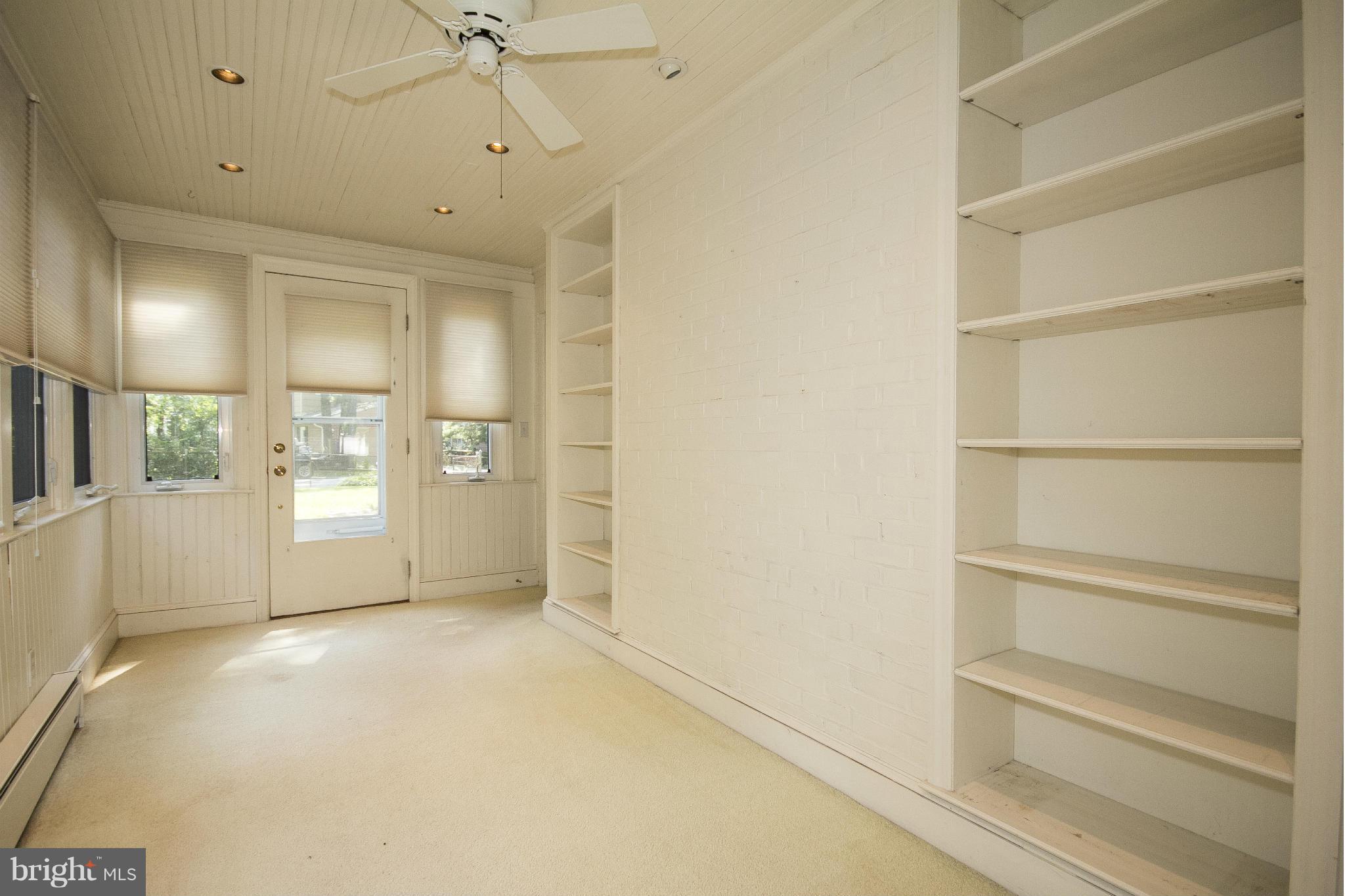 6911 Kenleigh Road Baltimore, MD 21212 - Photo 6 of 26 a view of an empty room with a window