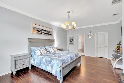 a bedroom with bed and furniture