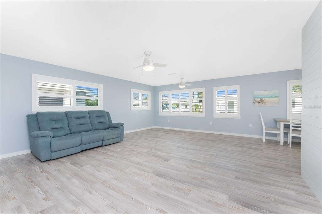 1977 Beach Road, Unit 3 Englewood, FL 34223 - Photo 12 of 56 a living room with furniture and a wooden floor