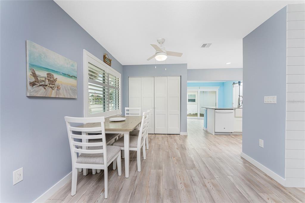 1977 Beach Road, Unit 3 Englewood, FL 34223 - Photo 18 of 56 a view of a dining room with furniture and wooden floor