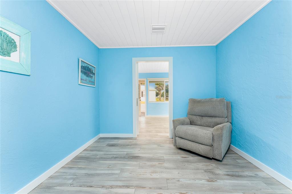 1977 Beach Road, Unit 3 Englewood, FL 34223 - Photo 24 of 56 a living room with furniture and a wooden floor