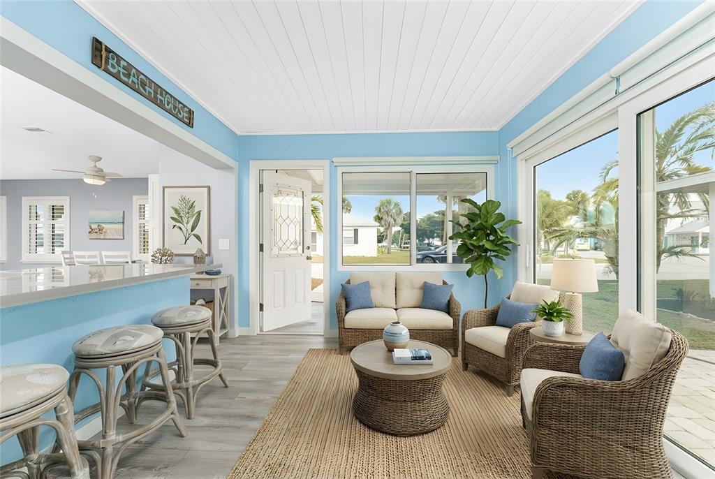 1977 Beach Road, Unit 3 Englewood, FL 34223 - Photo 27 of 56 a living room with furniture and a large window