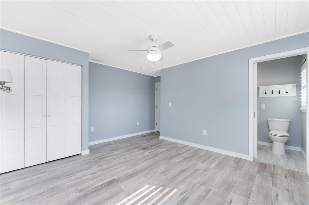 1977 Beach Road, Unit 3 Englewood, FL 34223 - Photo 32 of 56 wooden floor in an empty room with a bathroom