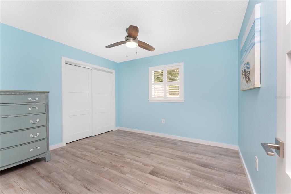 1977 Beach Road, Unit 3 Englewood, FL 34223 - Photo 38 of 56 a view of an empty room with a window and wooden floor