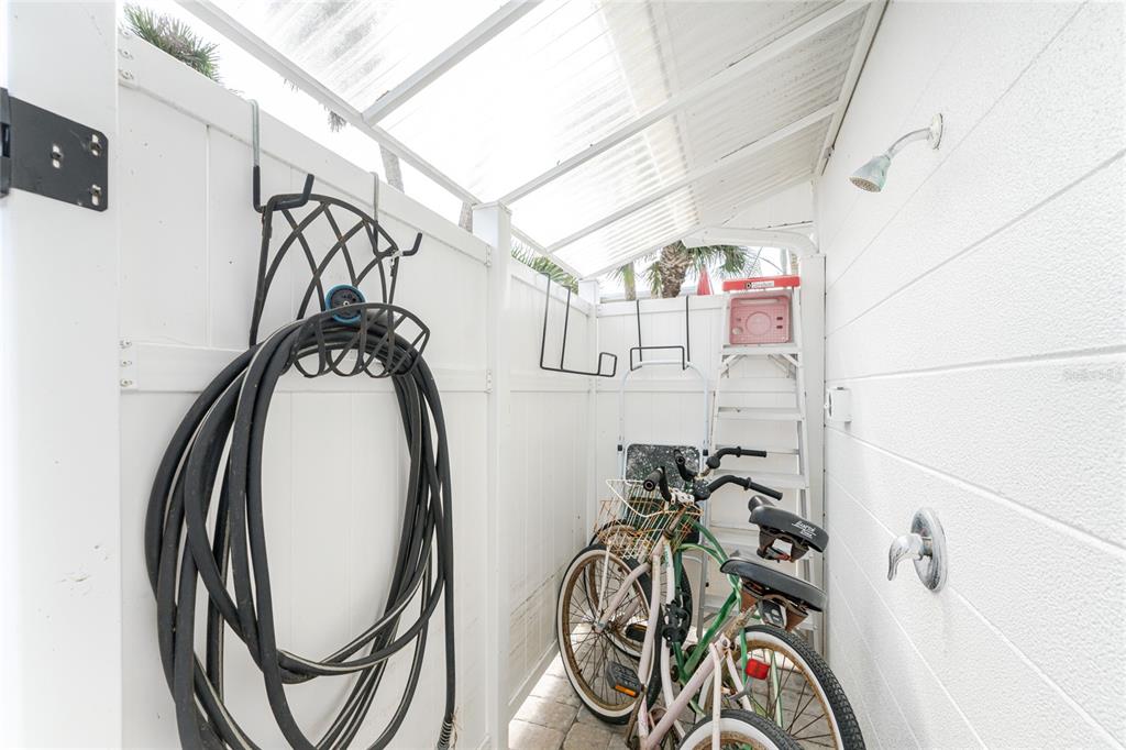 1977 Beach Road, Unit 3 Englewood, FL 34223 - Photo 43 of 56 a view of a bike storage and utility room with rack on the wall