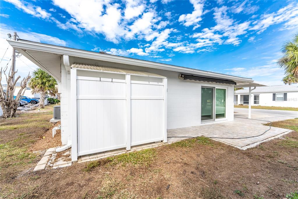 1977 Beach Road, Unit 3 Englewood, FL 34223 - Photo 44 of 56 a view of backyard with a garden and plants