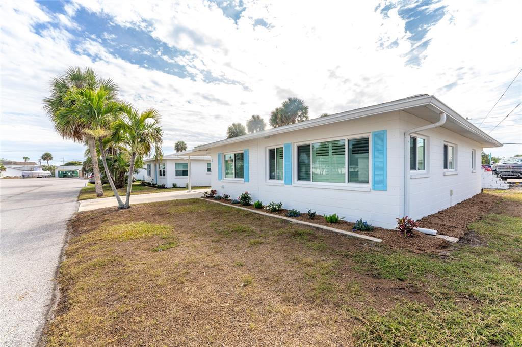 1977 Beach Road, Unit 3 Englewood, FL 34223 - Photo 47 of 56 a view of a house with a yard