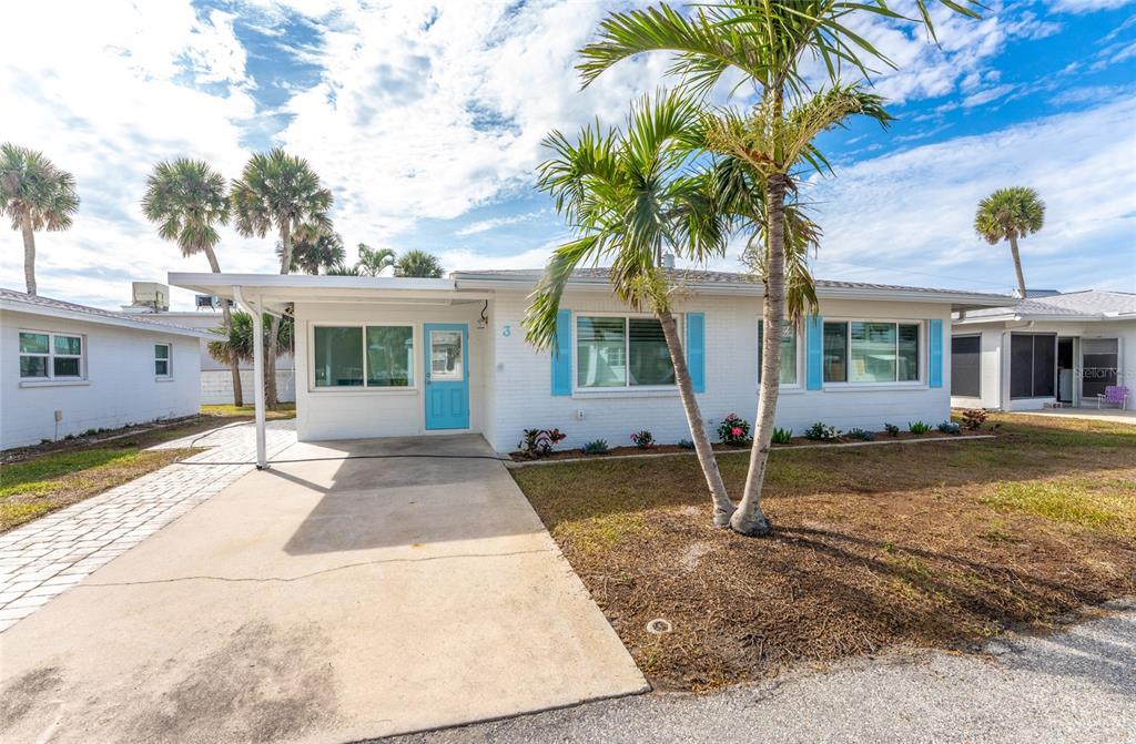 1977 Beach Road, Unit 3 Englewood, FL 34223 - Photo 48 of 56 a front view of a house with garden