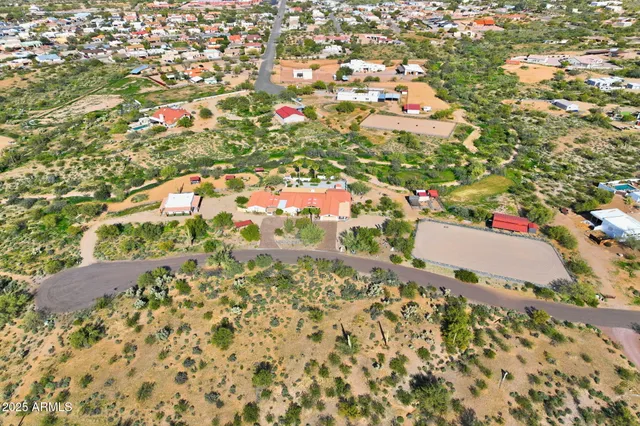 an aerial view of residential houses with outdoor space