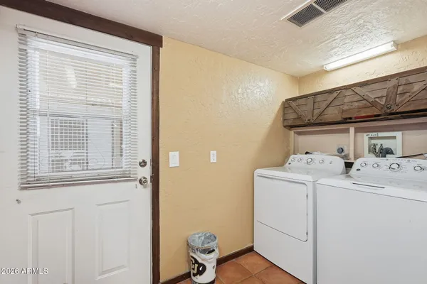 a view of a lush green hillside and houses