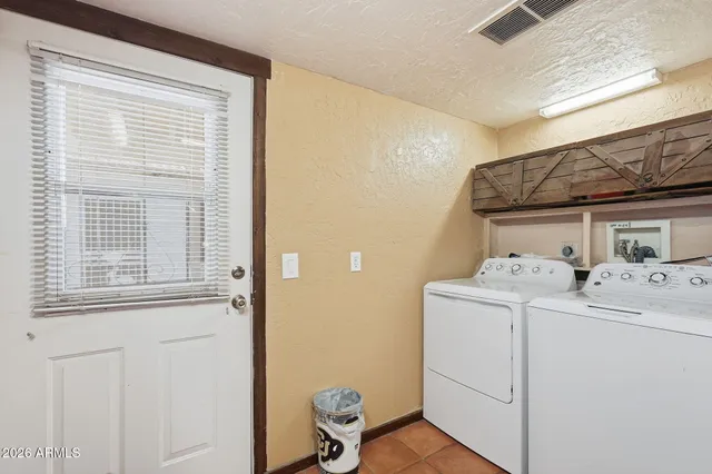 a view of a lush green hillside and houses