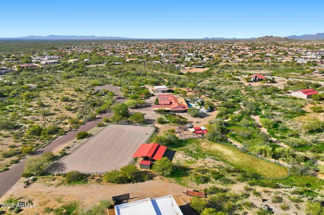 a large kitchen with kitchen island a sink a stove and a refrigerator