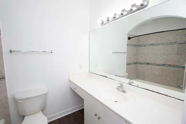 a bathroom with a sink and mirror