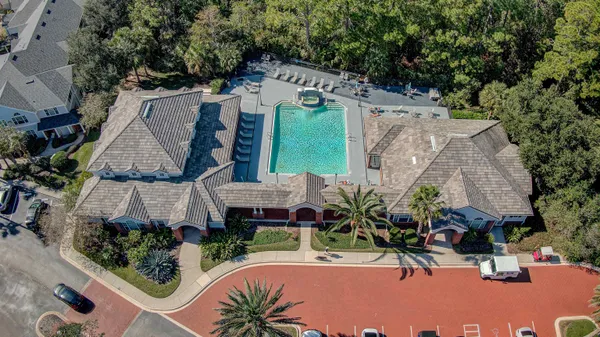 an aerial view of a house with outdoor space patio and outdoor seating