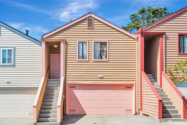a view of a house with large windows